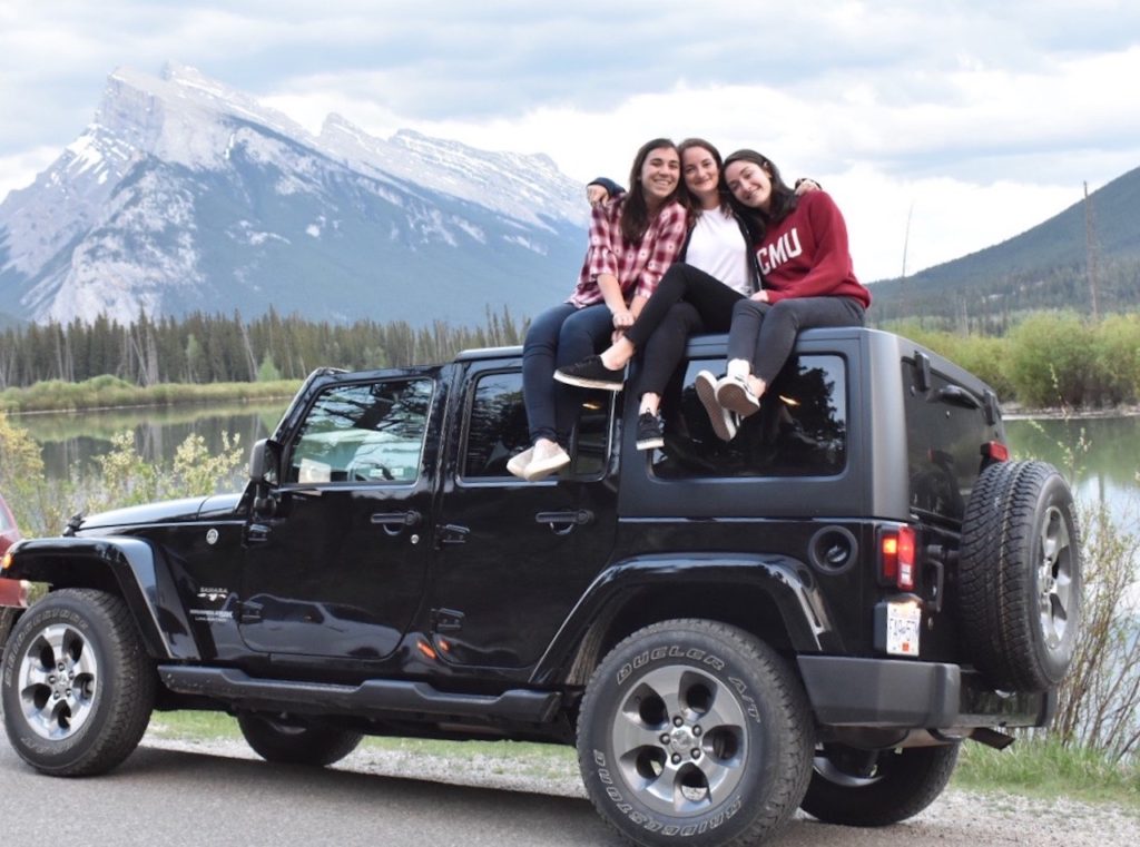 three girls on a jeep at Vermillion Lakes