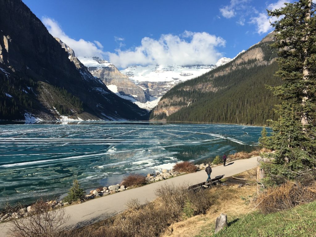 picture of lake louise on the shoreline with ice in the lake
