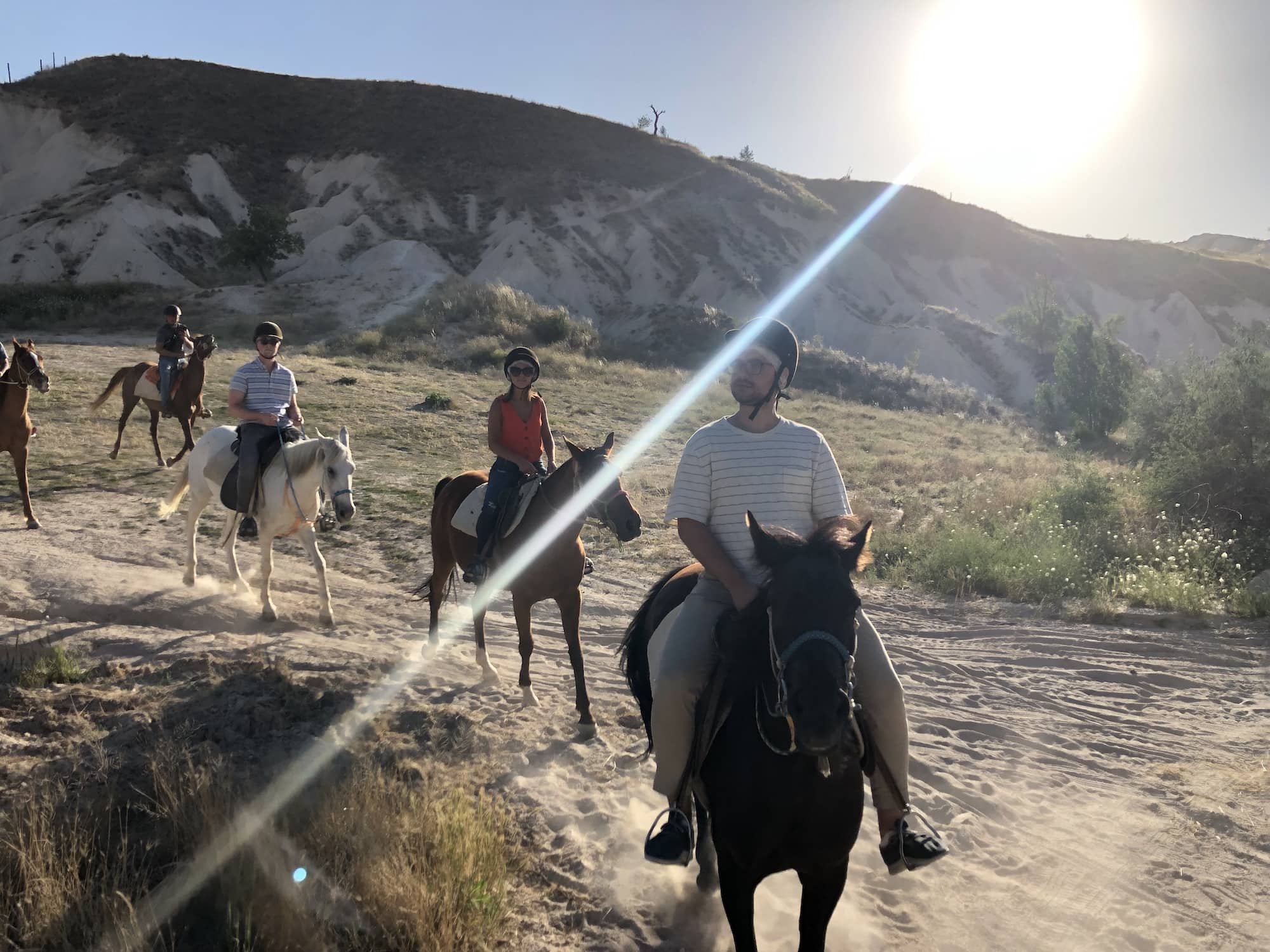 four people on horses