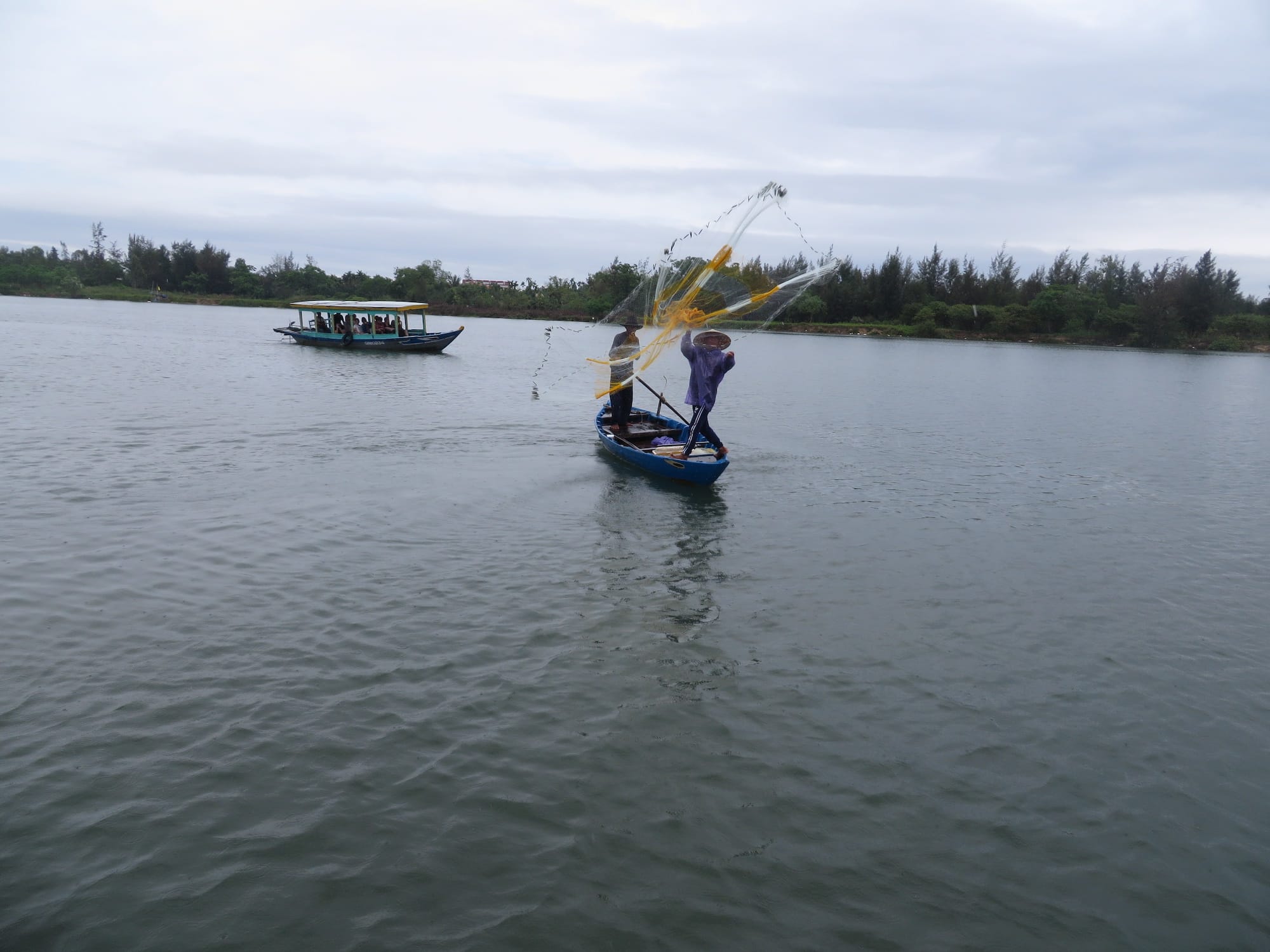 fisherman casting a net