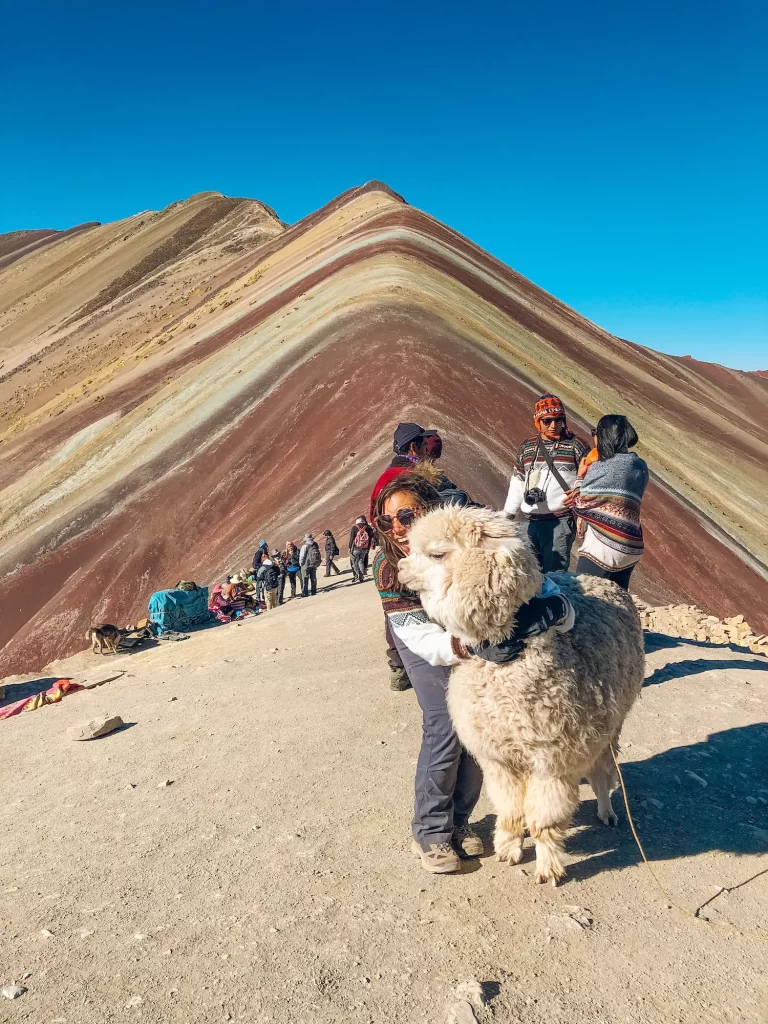 girl with llama at rainbow mountain