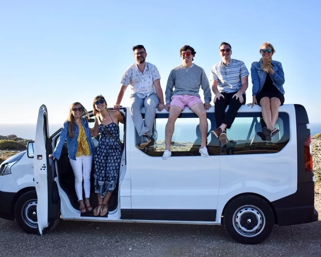 Big van with a few people standing on it