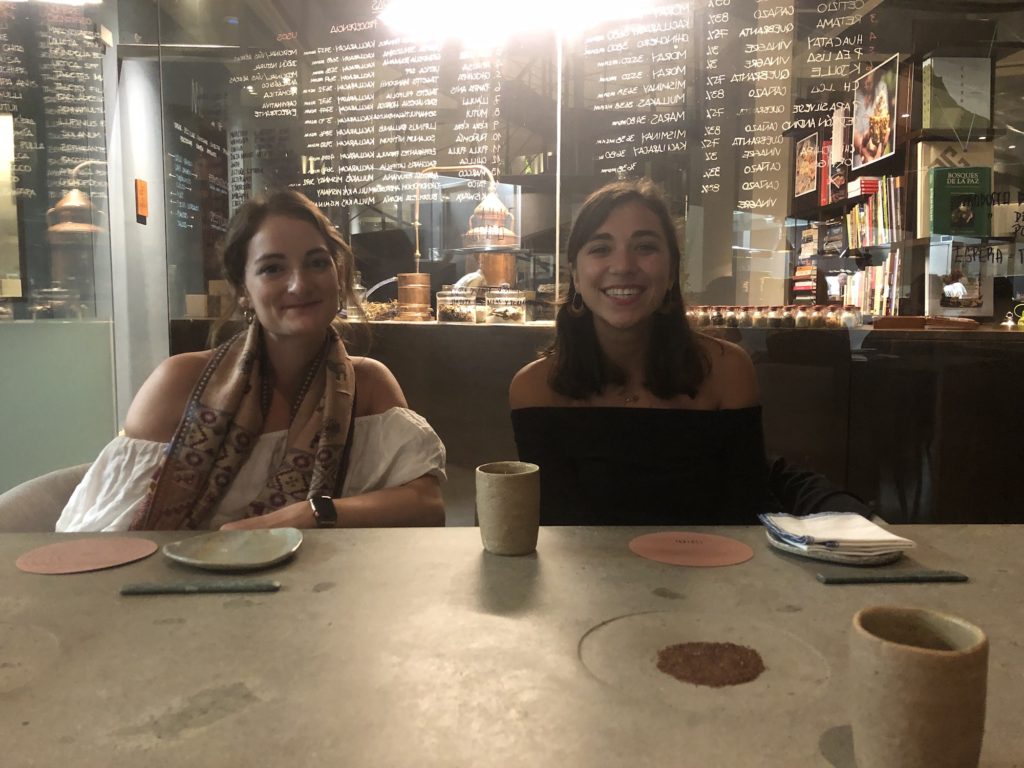 two girls sitting at the table in Central