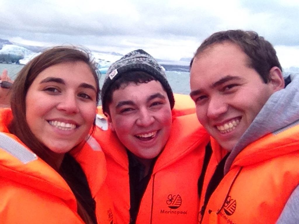 three people in life jackets