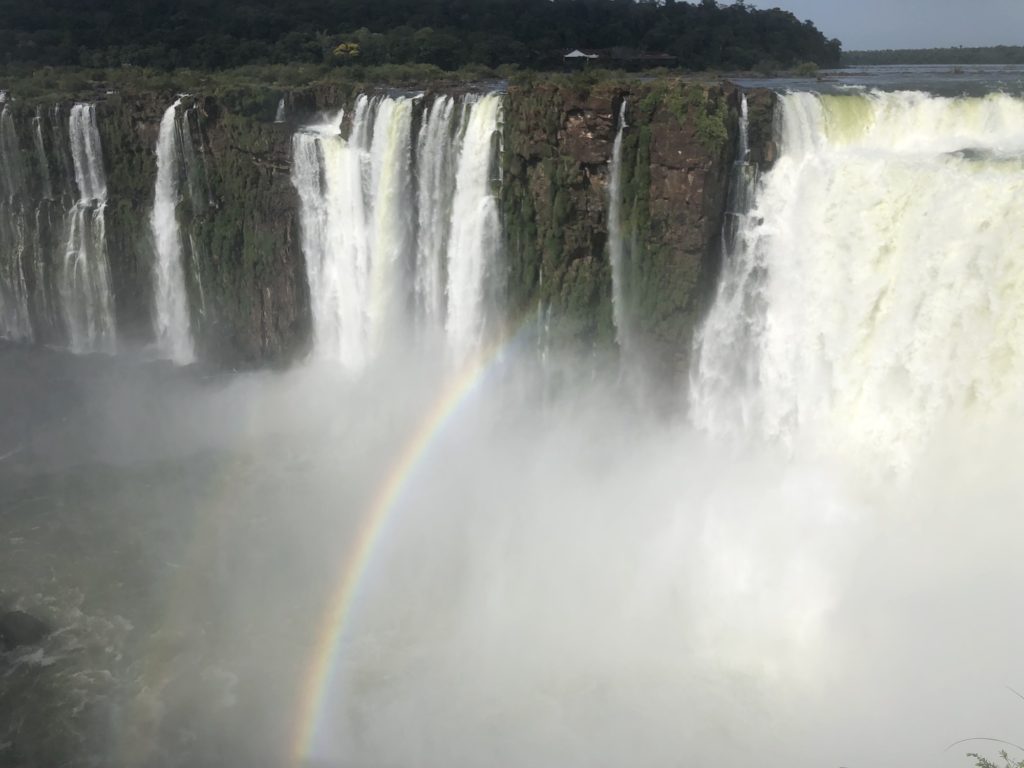 View of Iguazu Falls with rainbow from devil's throat