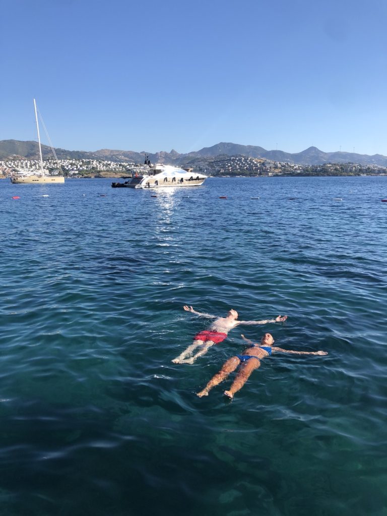 Two people floating in sea