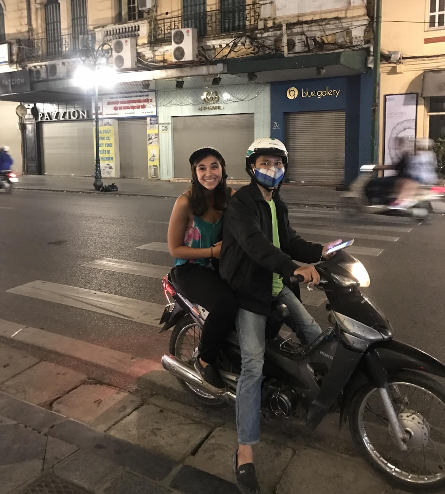 Female on back of motorbike with driver