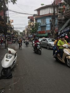 Motorbikes driving through streets of Hanoi