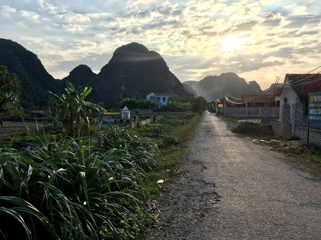 sunset over the hills of tam coc