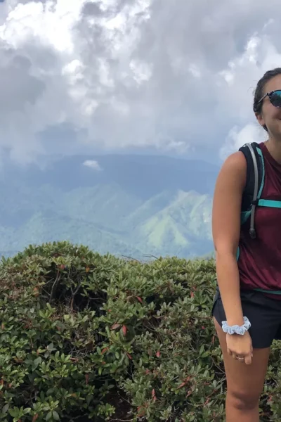 woman smiling on the top of mount leconte in the great smoky mountains