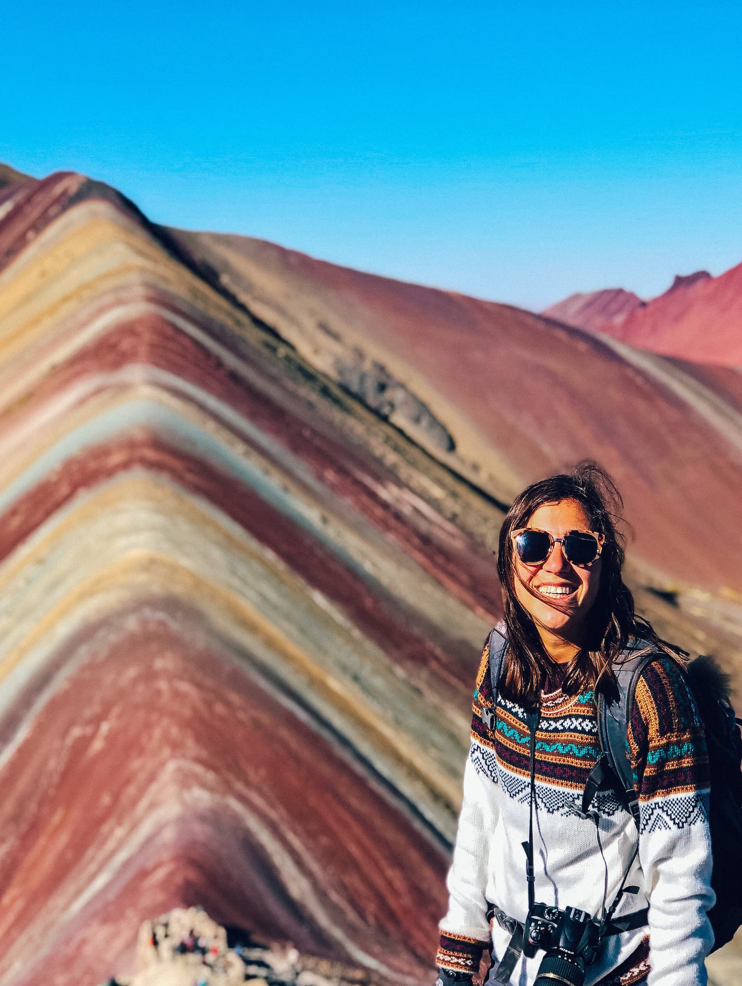 Girl in front of Rainbow Mountain