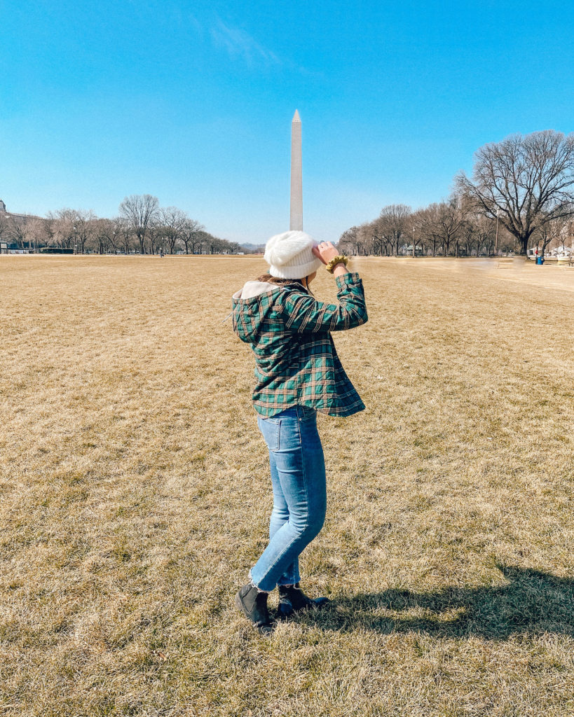 Tips for Traveling on a Budget; Girl in front of washington Monument