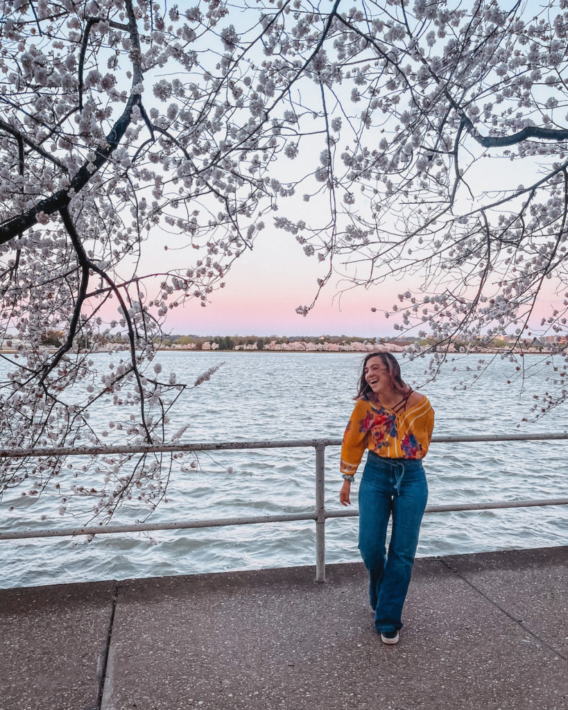 girl laughing in front of blooms at Tidal Basin