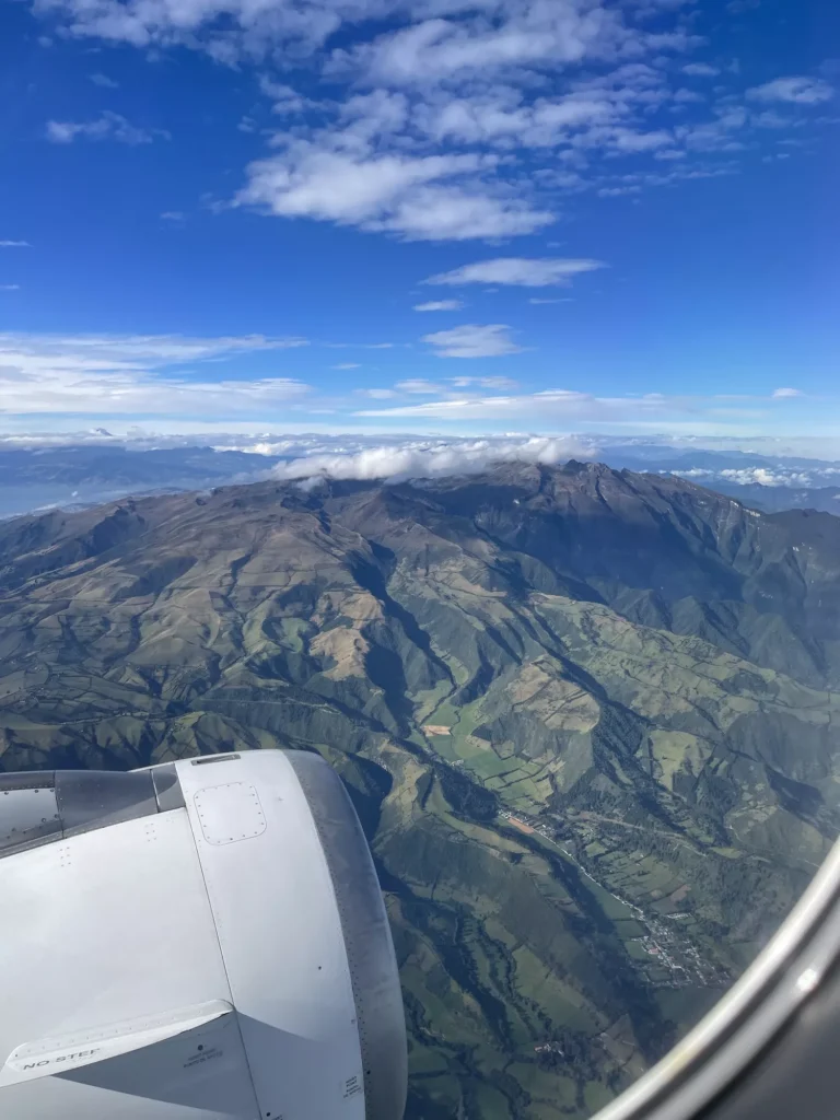 Mountains outside of window on plane from Quito