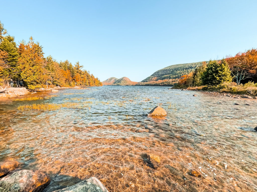 Jordan Pond with bubbles in background. Rocks through the clear water