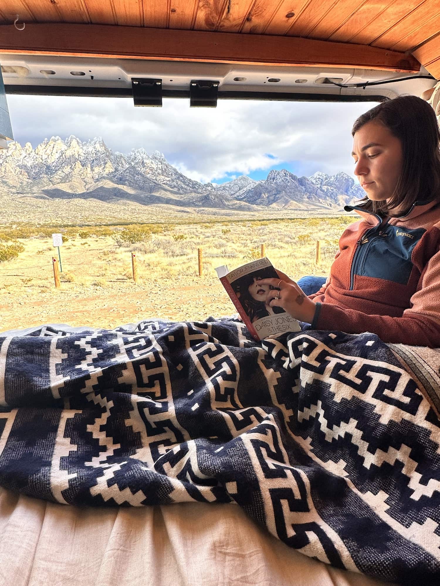 girl sitting in a van and reading