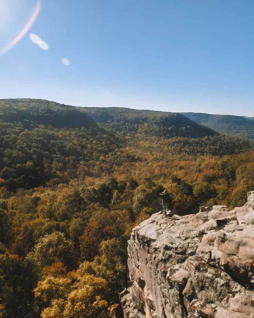 Girl standing on rock over mountains in Arkansas