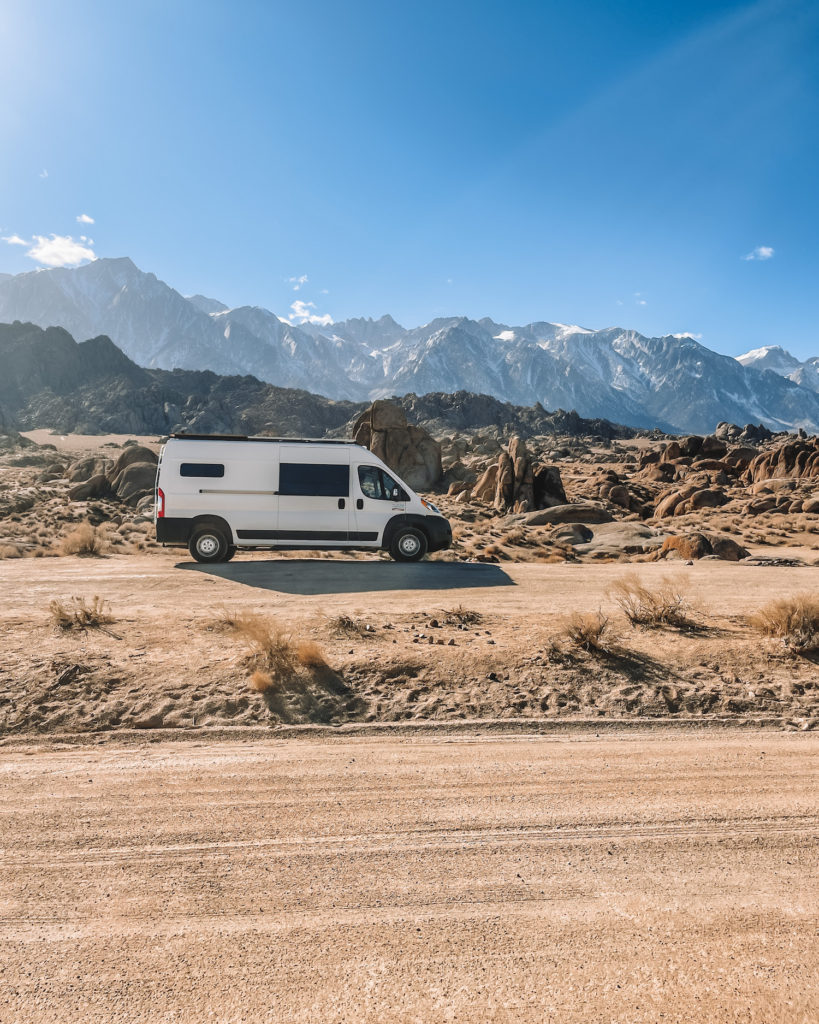 Van in front of the alabama hills in the back