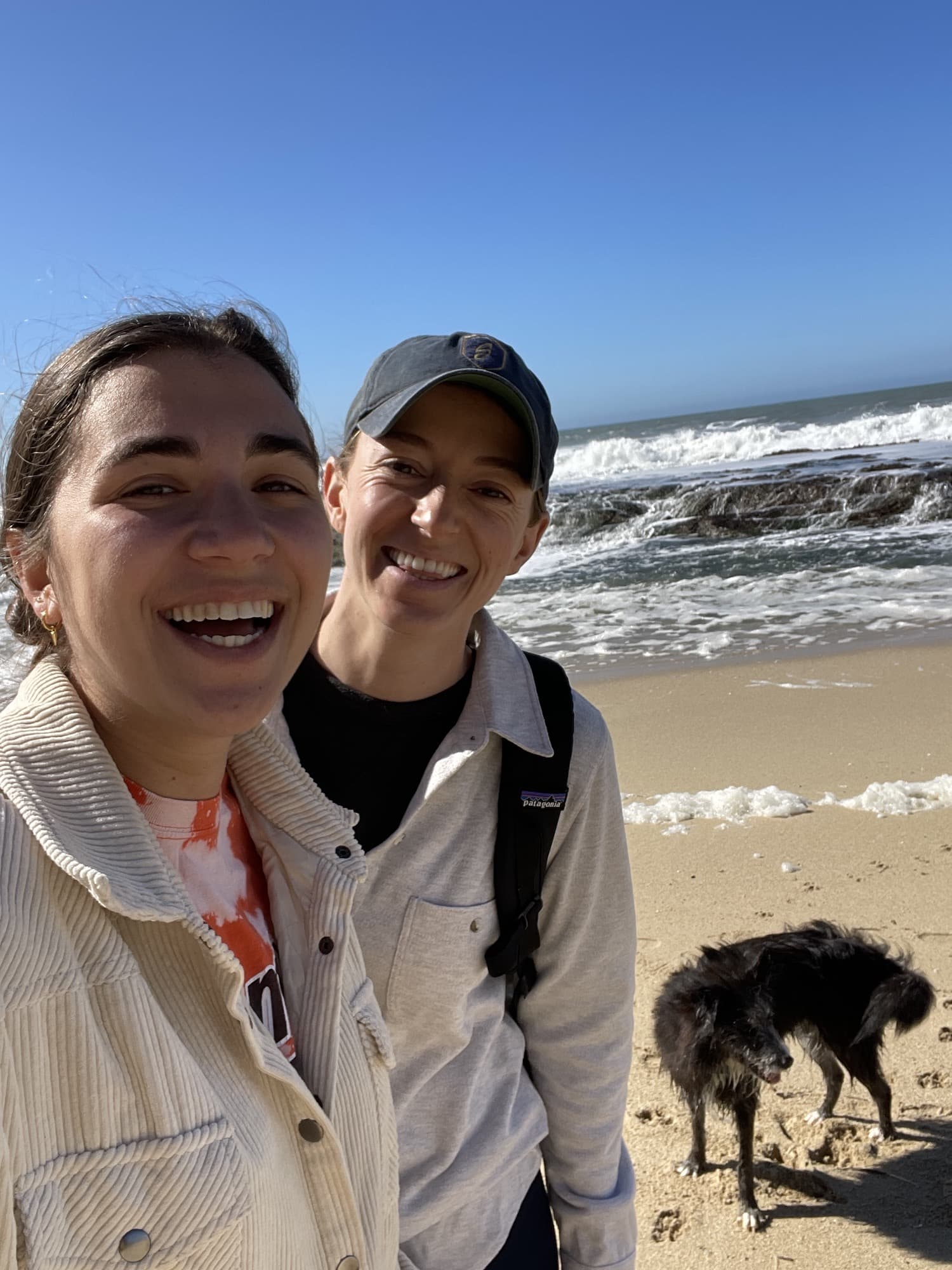 My friend and I with her dog on the beach