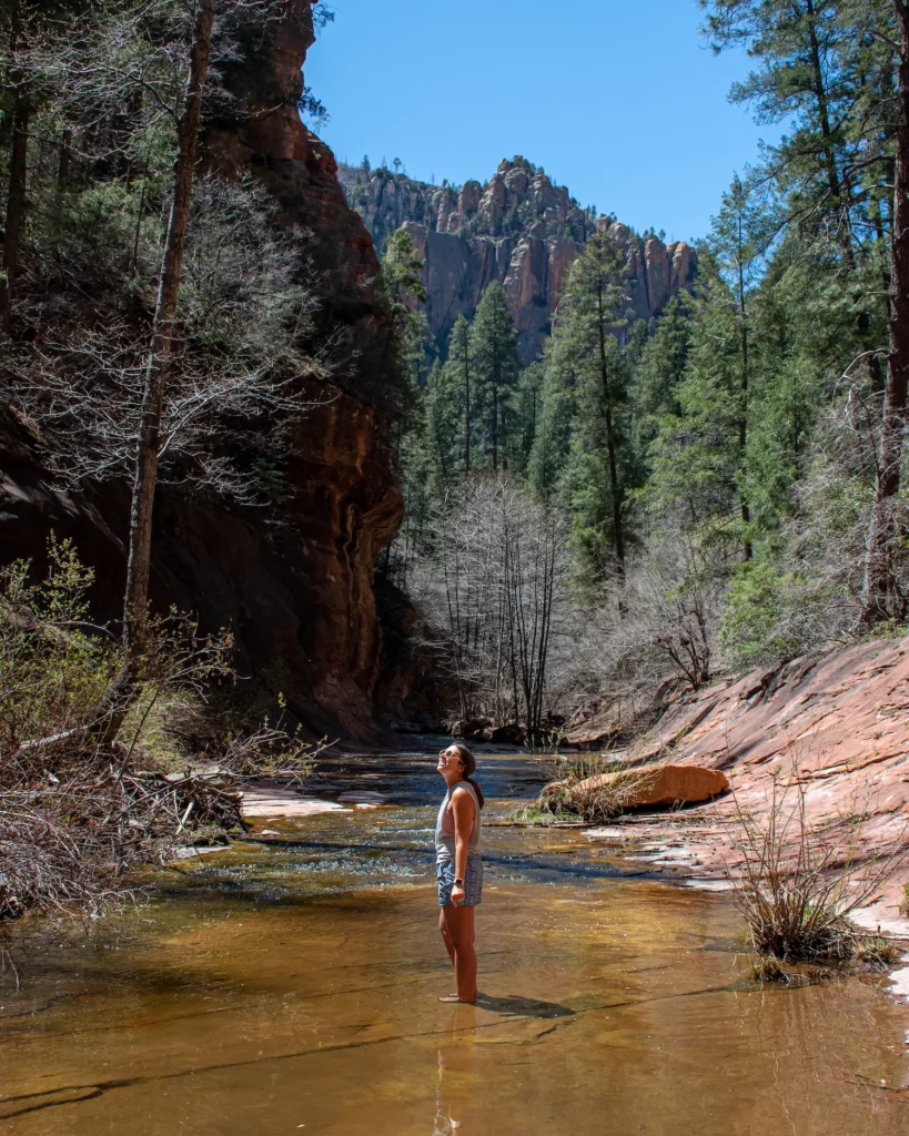 girl standing in water at West Fork River Trail