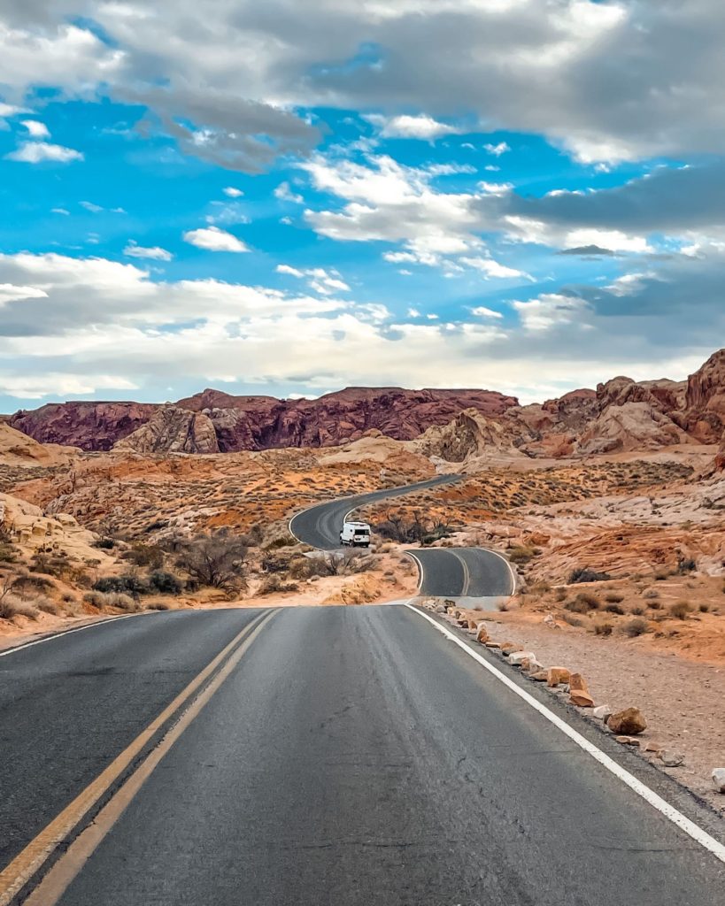 Van driving down the road in Valley of Fire State Park; driving from bryce canyon to capitol reef cover