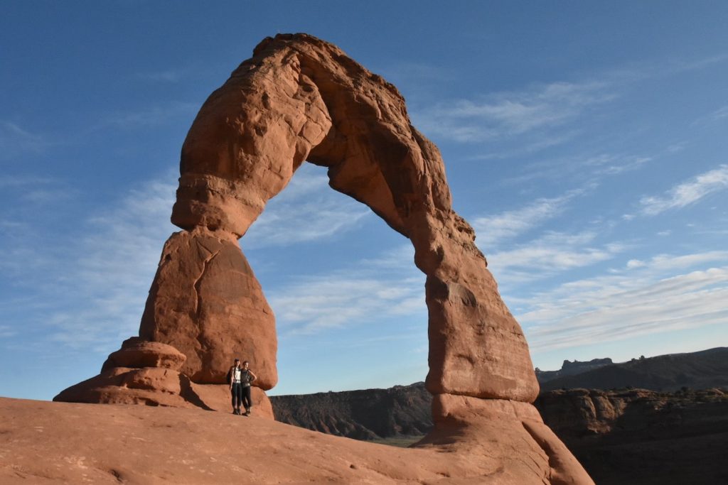 Two girls in front of Delicate Arch