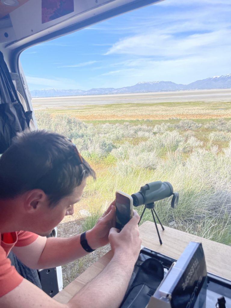 boy taking photos of wildlife at antelope island