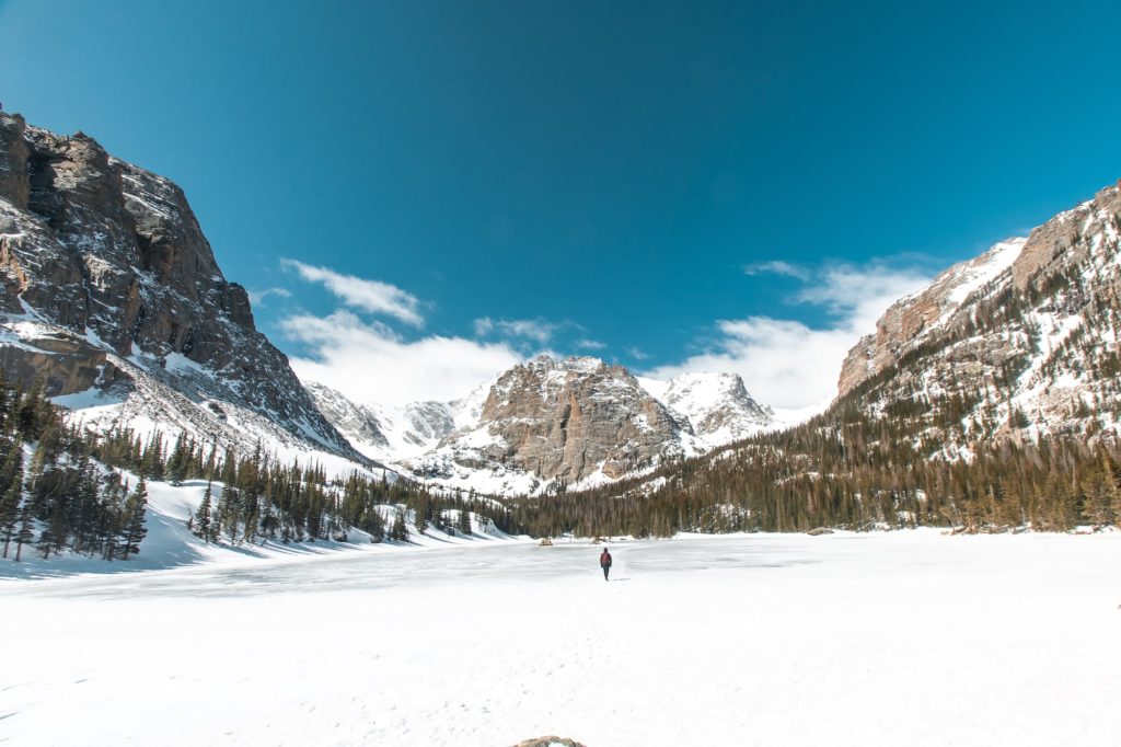 boy walking on frozen lake