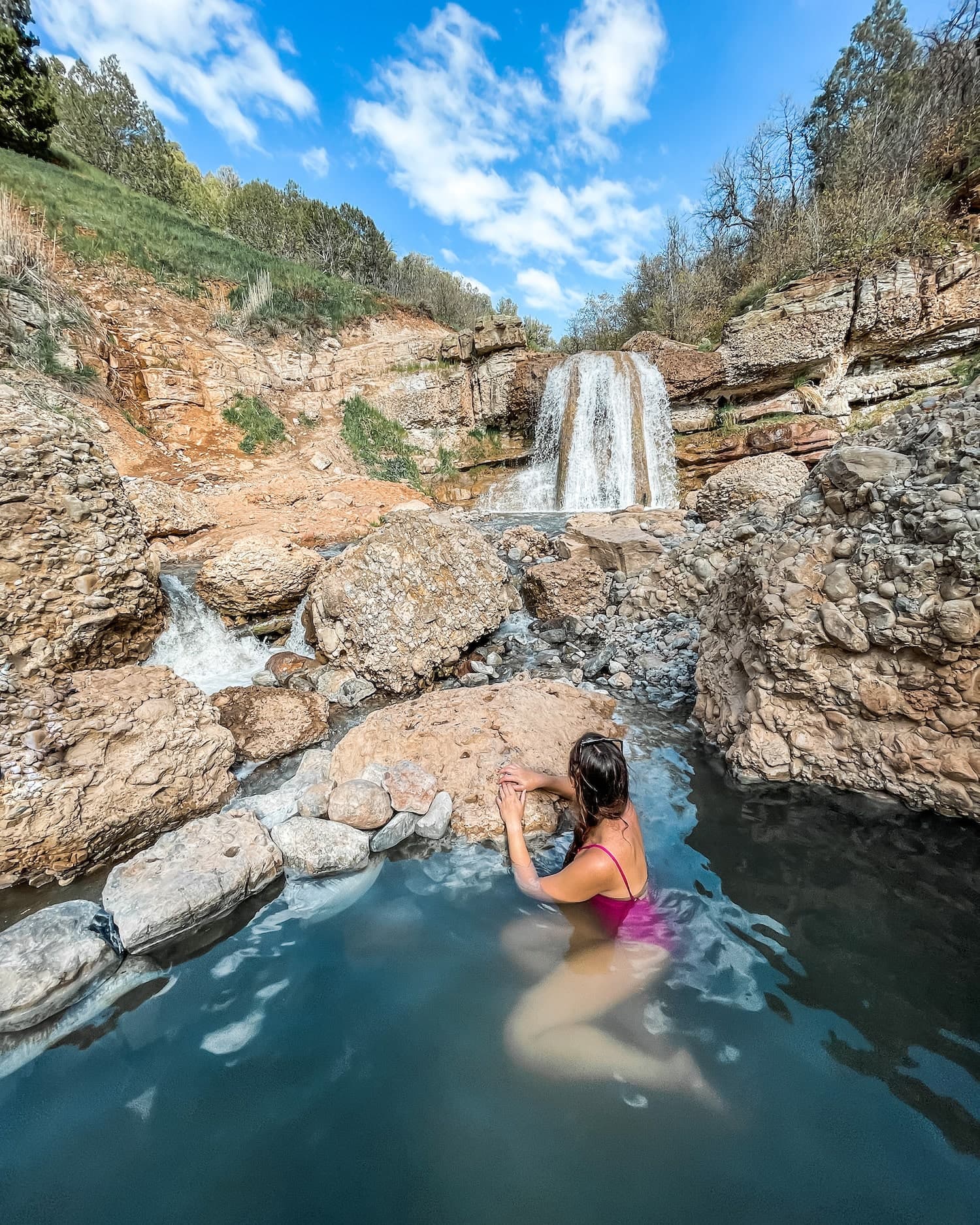 girl sitting in fifth water hot springs