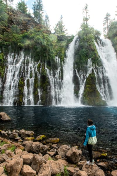 girl looking out at burney falls