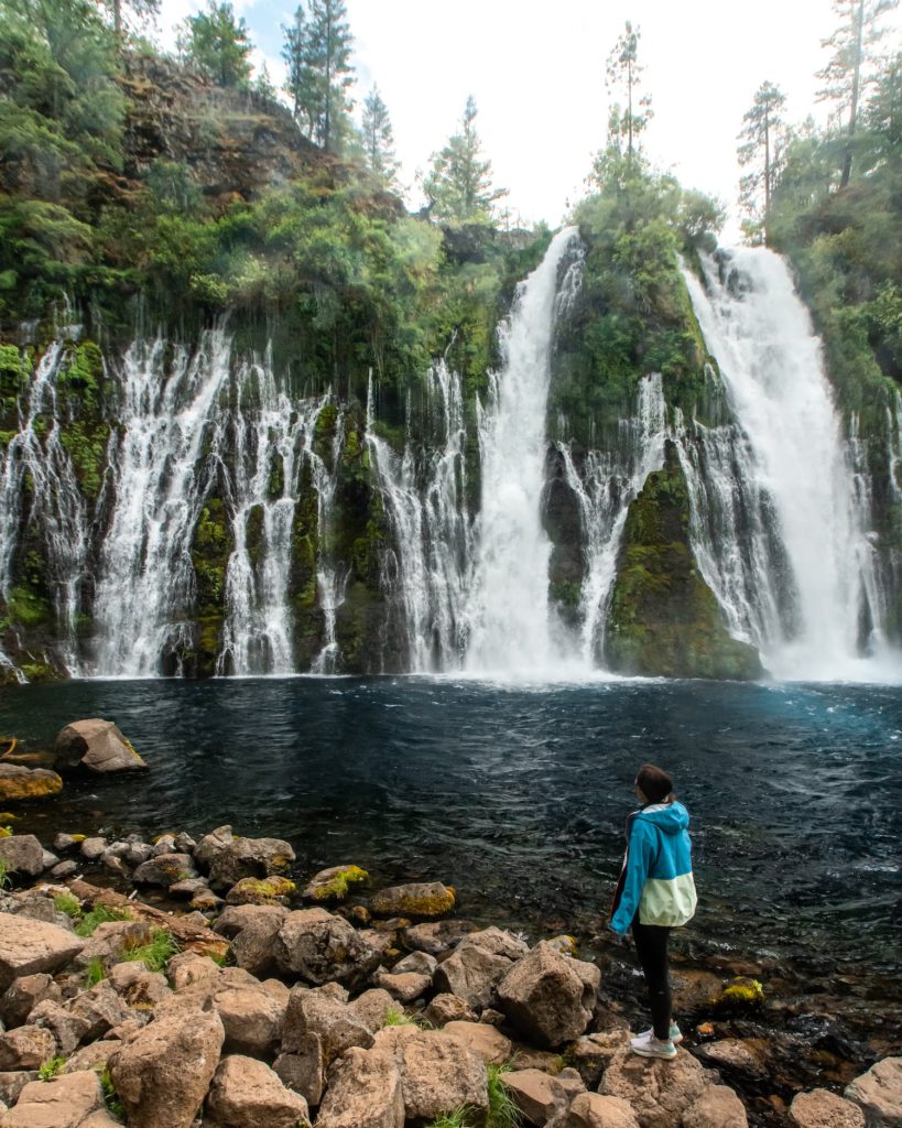 girl looking out at burney falls