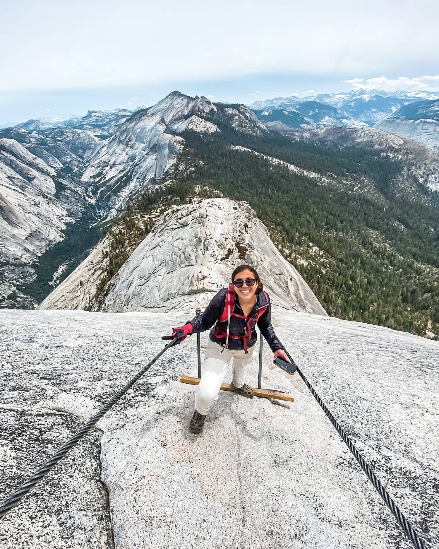 girl hiking half dome cables