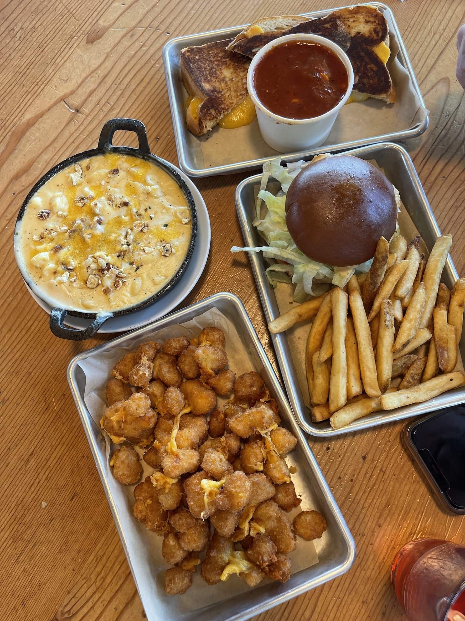 food from tillamook, mac and cheese, cheese curds, fries, cheeseburger, grilled cheese and tomato soup