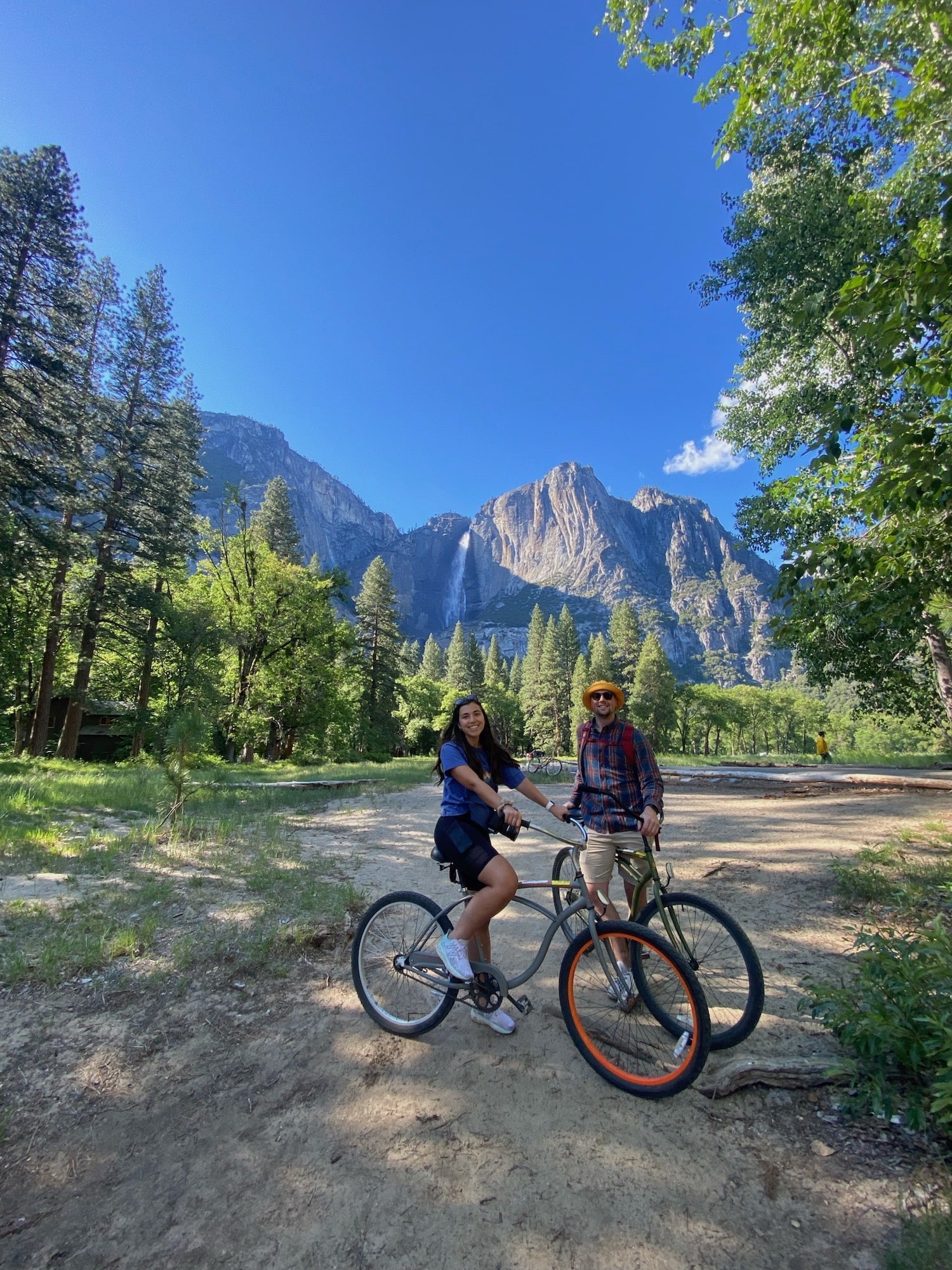 couple on bikes in Yosemite Valley