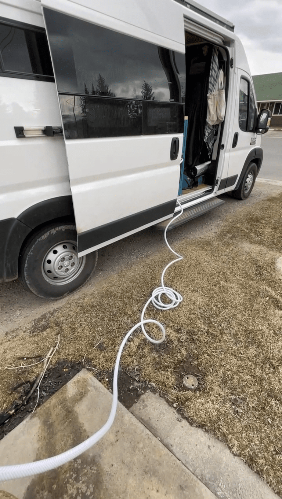 water hose connected to van