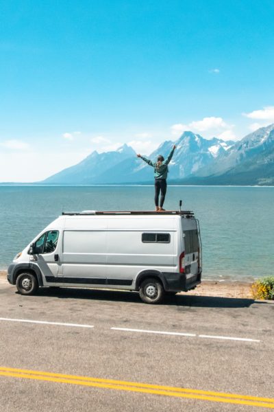 girl standing on van