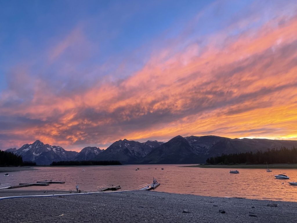 tetons with sunset overhead at coulter bay