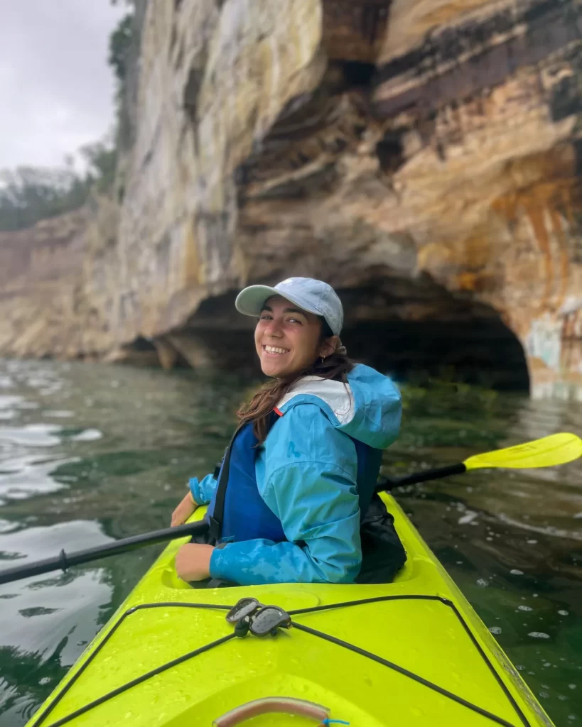 girl smiling back in a kayak