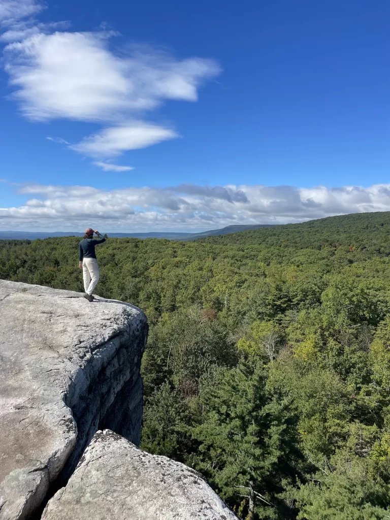 girl standing on gertrude's nose