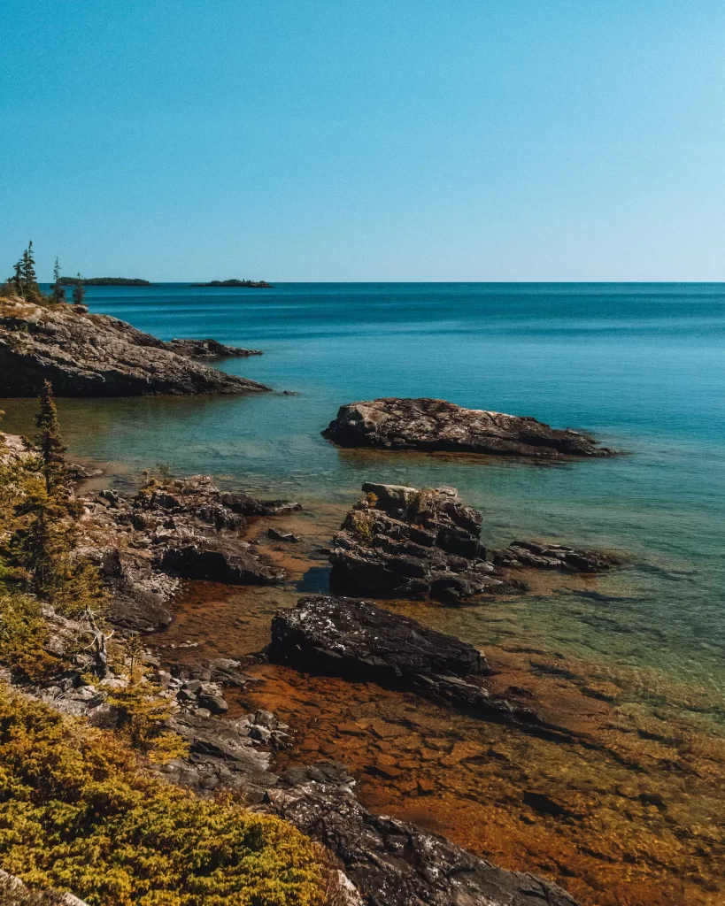 rocky coastline with shallow waters of isle royale