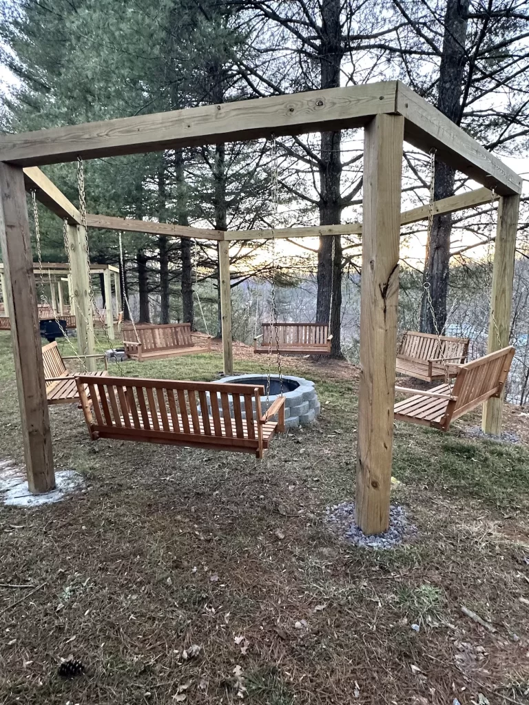 Wood swings with a fire pit in the middle of them