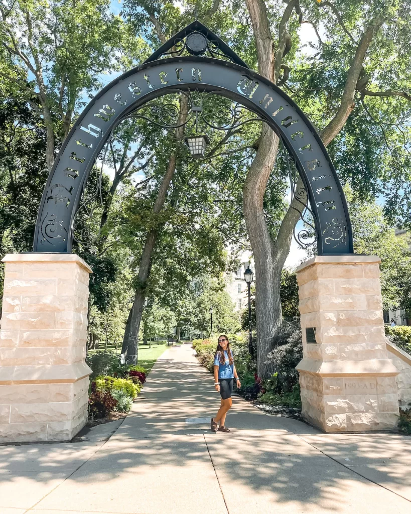 Girl standing under the Northwestern University Arch