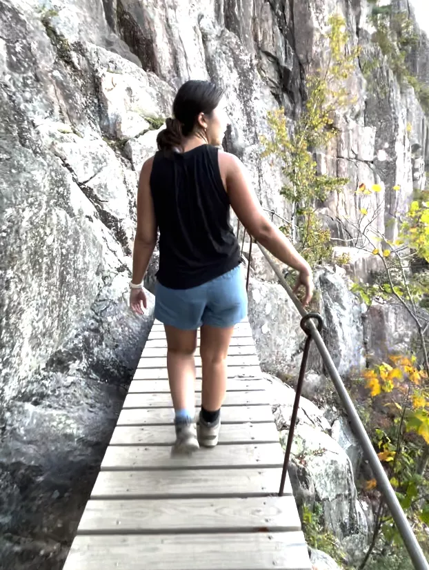 girl on wooden bridge