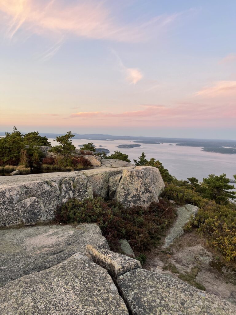 pink hues of sunset over frenchman bay off precipice loop