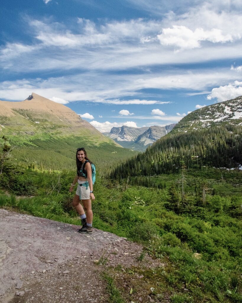girl on trail in glacier national park