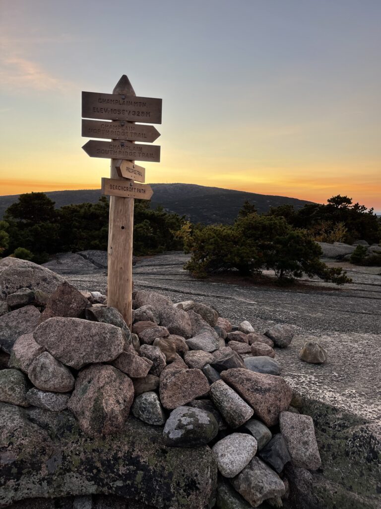 signs pointing to the different options to hike down the precipice trail