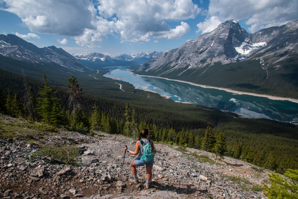 girl standing on reads tower with spray lakes behind