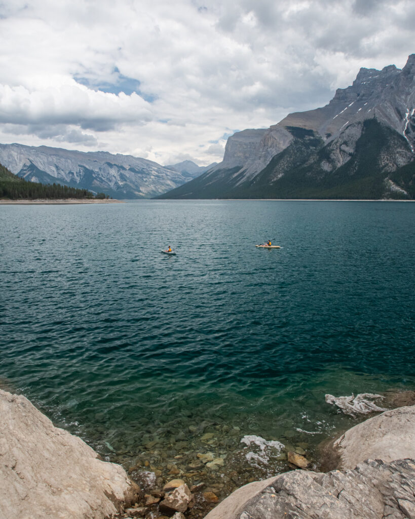 Lake Minnewanka with two kayakers in the water