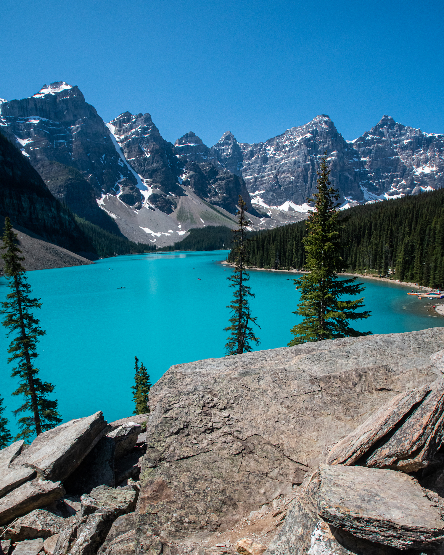 Moraine Lake with blue waters and jagged mountain peaks