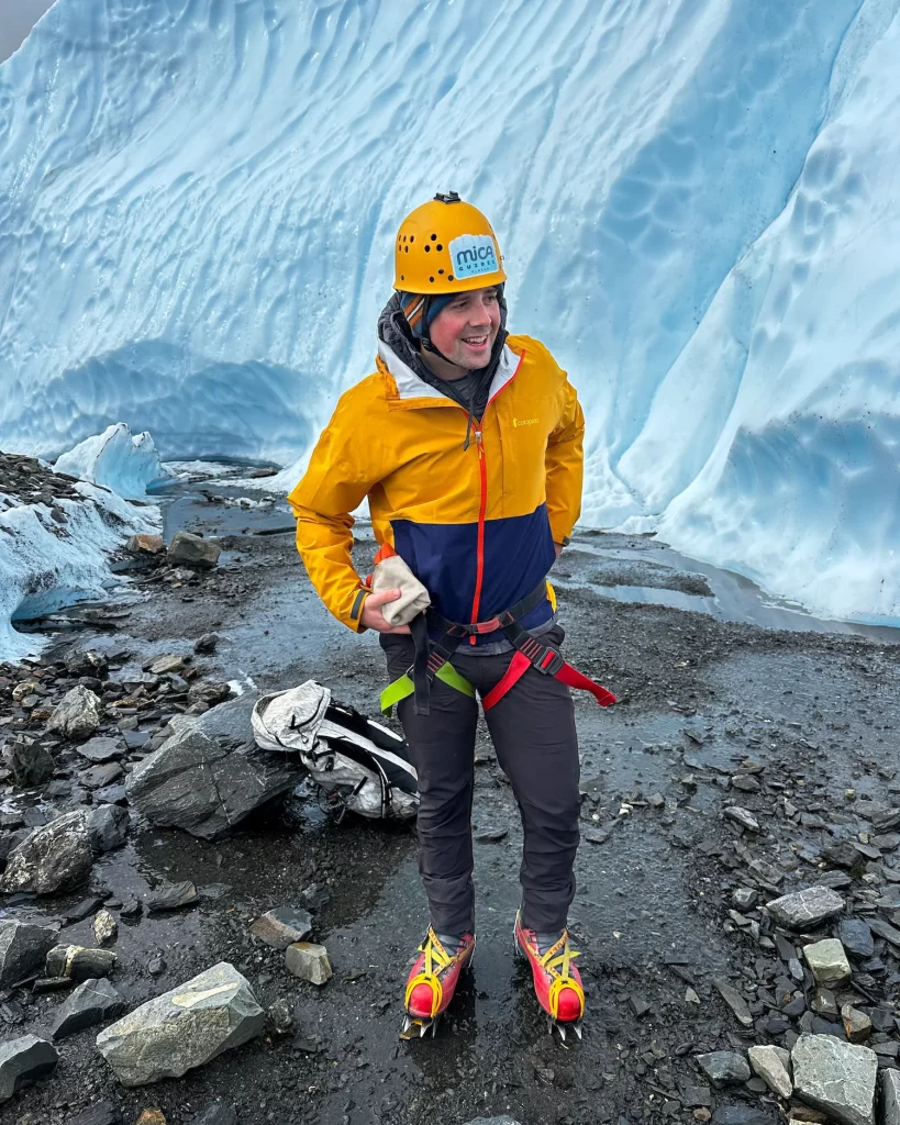 Dylan in the crampons, helmet, harness for ice climbing
